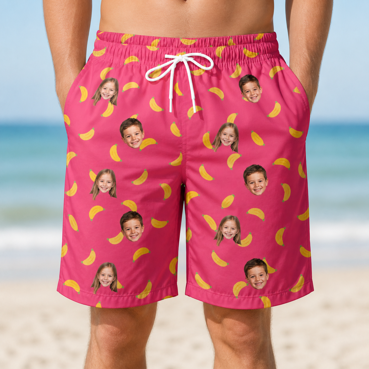 Model wearing Men's Banana Bonanza Custom Face Beach Shorts printed with kids' faces