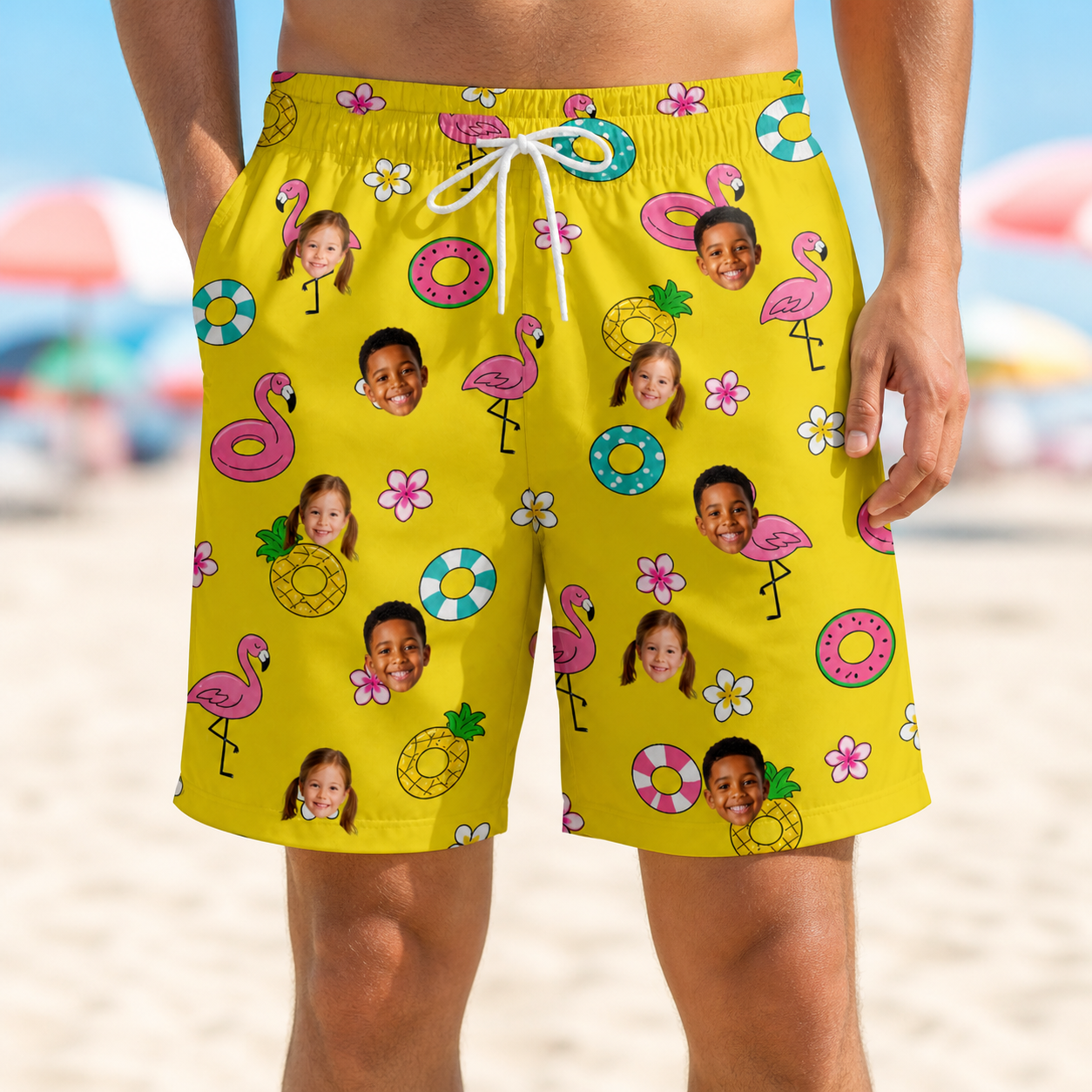 Model wearing Men's Aqua Aviary Custom Face Beach Shorts printed with kids' faces