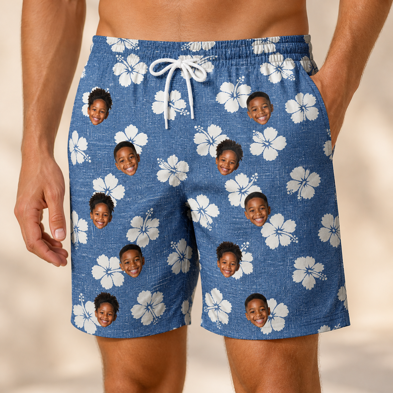 Model wearing Men's Riviera Reverie Custom Face Beach Shorts printed with kids' faces