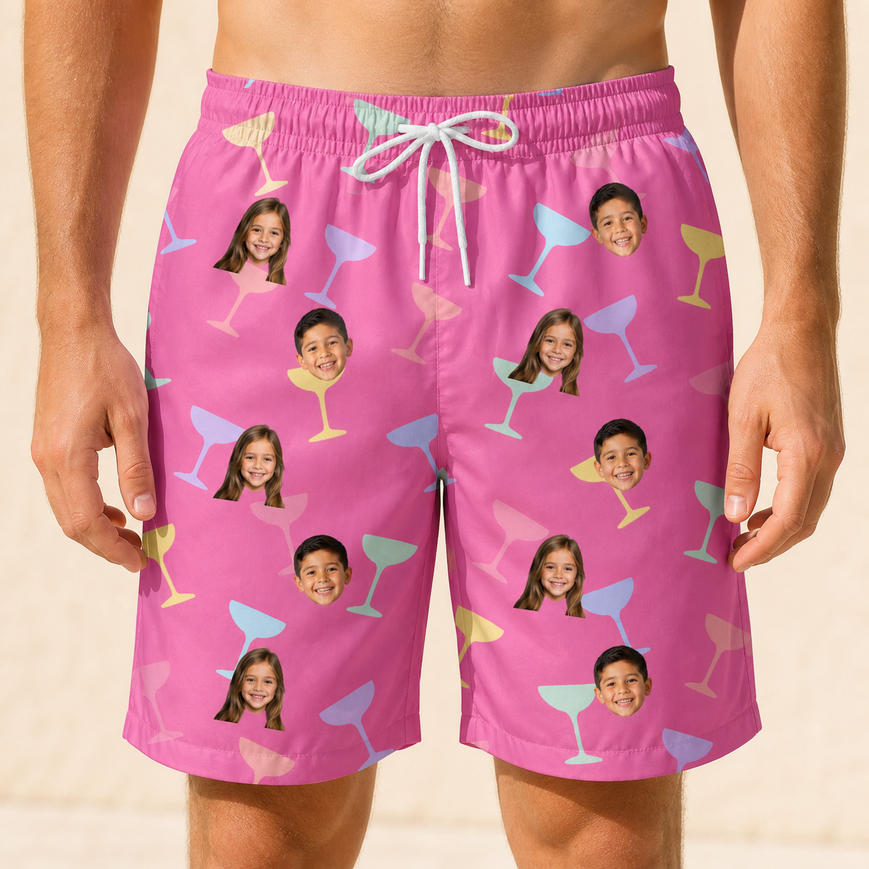 Model wearing Men's Prosecco Pizzazz Custom Face Beach Shorts printed with kids' faces
