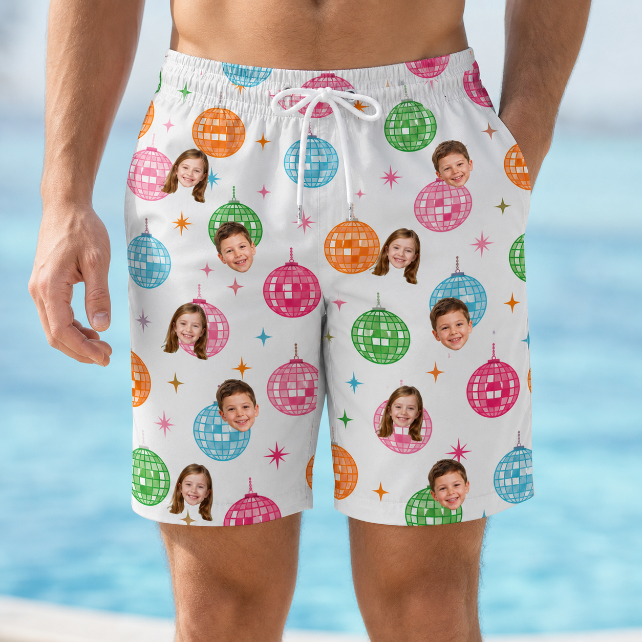Model wearing Men's Strobe Sweethearts Custom Face Beach Shorts printed with kids' faces