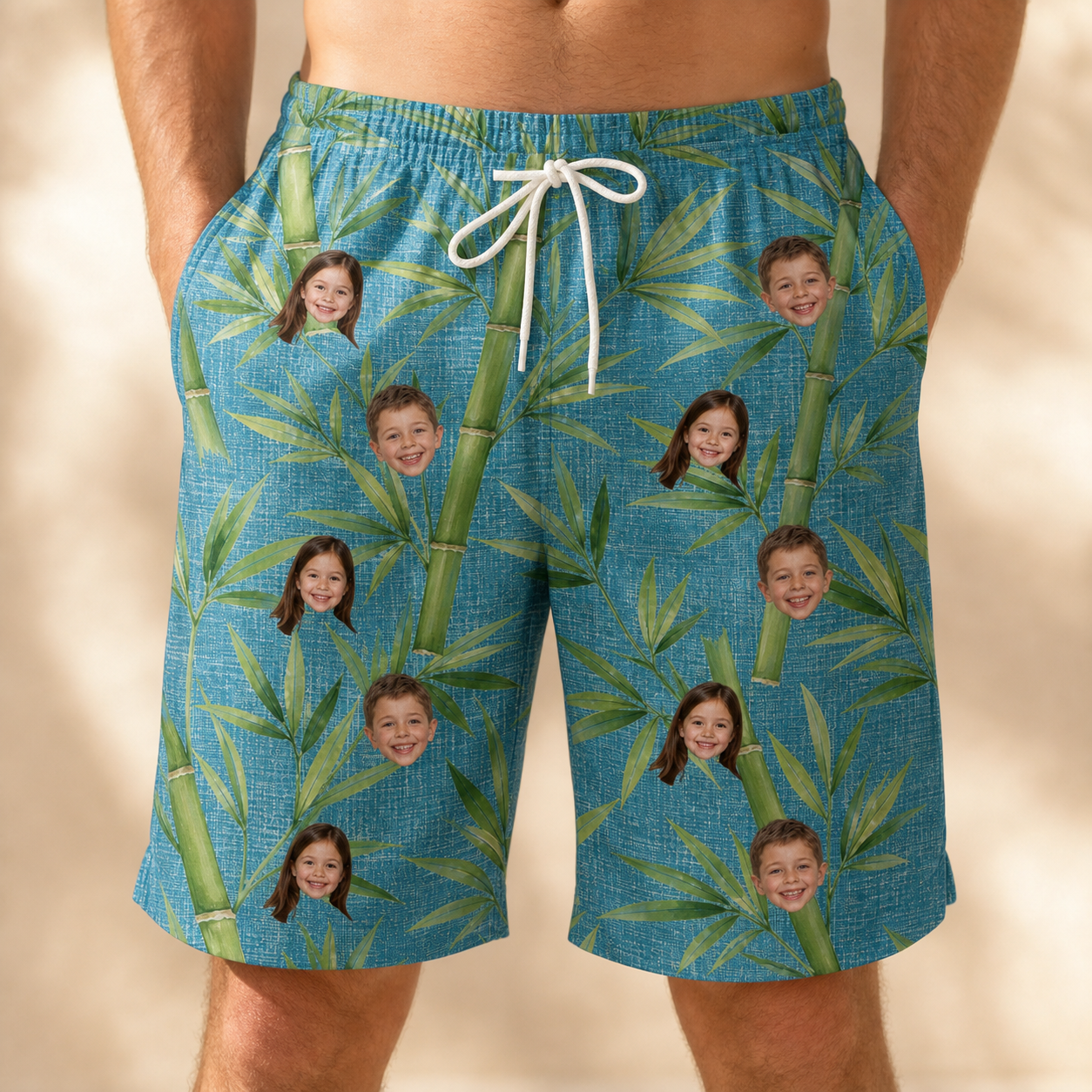 Model wearing Men's Bamboo Boogie Custom Face Beach Shorts printed with kids' faces