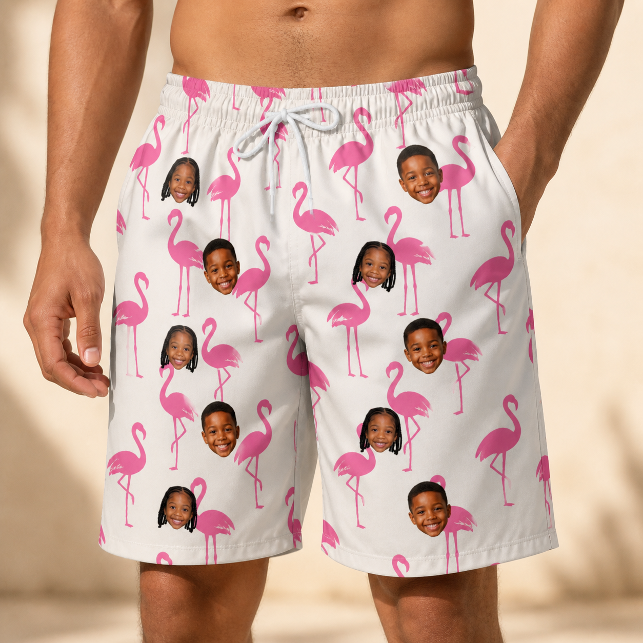 Model wearing Men's Bubblegum Ballerinas Custom Face Beach Shorts printed with kids' faces