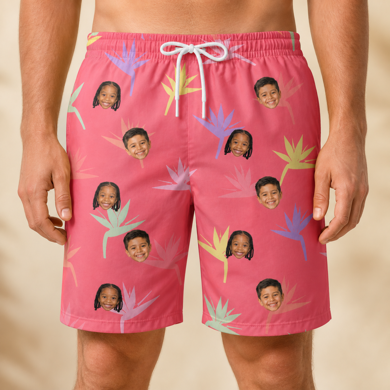 Model wearing Men's Paradise Punch Custom Face Beach Shorts printed with kids' faces