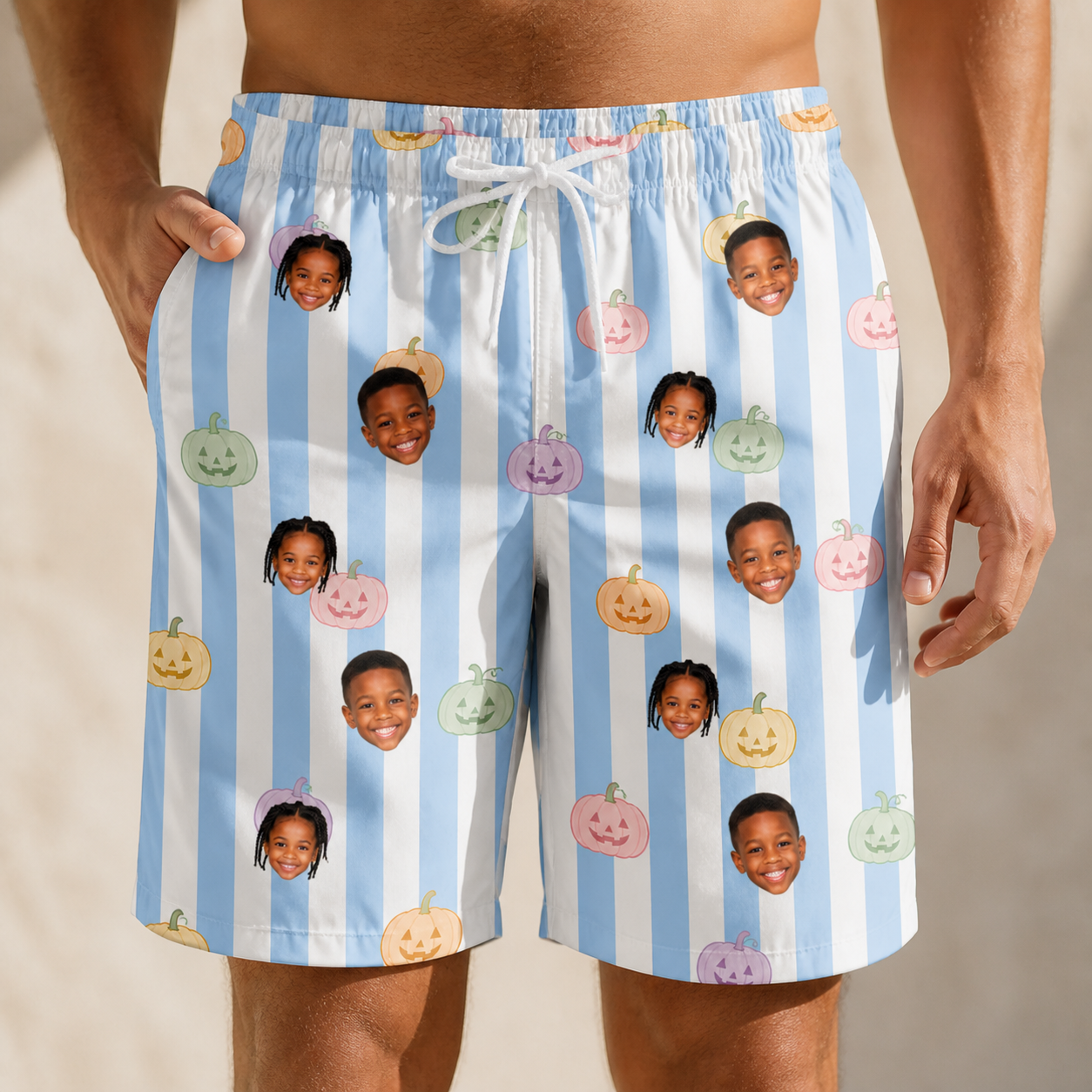 Model wearing Men's Harvest Haunters Custom Face Beach Shorts printed with kids' faces