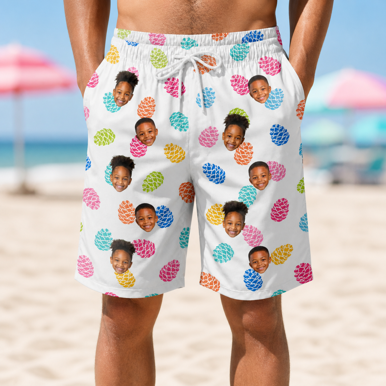 Model wearing Men's Pinecone Prance Custom Face Beach Shorts printed with kids' faces