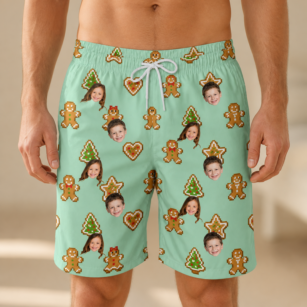 Model wearing Men's Gingerbread Gallop Custom Face Beach Shorts printed with kids' faces