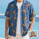 Man wearing Men's Flamingo Wink Parade Custom Face Hawaiian Shirt open over a white tee