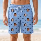 Model wearing Men's Fin Flickers Custom Face Beach Shorts printed with kids' faces