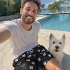 Selfie with the pet whose face is printed all over this Men's Bark Buckles Custom Dog Face Beach Shorts