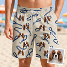 Man wearing Men's Leash Lineup Custom Dog Face Beach Shorts — custom faces printed all-over