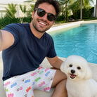 Selfie with the pet whose face is printed all over this Men's Tag Wag Custom Dog Face Beach Shorts