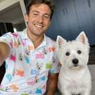 Selfie with the pet whose face is printed all over this Men's Tag Wag Custom Dog Face Polo Shirt