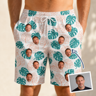 Man wearing Men's Caladium Carnival Custom Face Beach Shorts — custom faces printed all-over