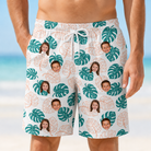 Model wearing Men's Caladium Carnival Custom Face Beach Shorts printed with kids' faces