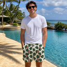 Real-life photo of someone wearing Men's Verdant Vacation Custom Face Beach Shorts — custom faces printed all-over