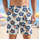 Model wearing Men's Deco Garden Custom Face Beach Shorts printed with kids' faces