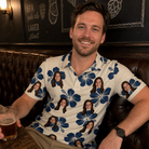 Real-life photo of someone wearing Men's Deco Garden Custom Face Polo Shirt — custom faces printed all-over