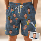 Man wearing Men's Lounge Libations Custom Face Beach Shorts — custom faces printed all-over