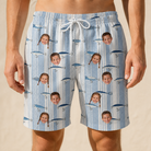 Model wearing Men's Spoon Sizzle Custom Face Beach Shorts printed with kids' faces