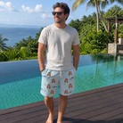 Real-life photo of someone wearing Men's Pelagic Prowess Custom Face Beach Shorts — custom faces printed all-over