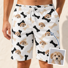 Man wearing Men's Biscuit Bark Custom Dog Face Beach Shorts — custom faces printed all-over