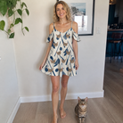 Full-length photo with the pet printed all over this Women's Catnip Kinetics Custom Cat Face Off-Shoulder Dress