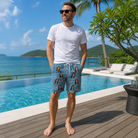 Real-life photo of someone wearing Men's Scuttle Sideshow Custom Face Beach Shorts — custom faces printed all-over