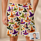 Man wearing Men's Samhain Silhouettes Custom Face Beach Shorts — custom faces printed all-over