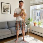 Full-length photo with the pet printed all over this Men's Christmas Cuffs Custom Cat Face Beach Shorts
