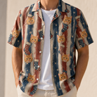 Man wearing Men's Christmas Cuffs Custom Cat Face Hawaiian Shirt open over a white tee