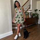 Full-length photo with the pet printed all over this Women's Trimmed Tannenbaums Custom Cat Face V-Neck Dress