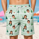 Model wearing Men's Evergreen Extravaganza Custom Face Beach Shorts printed with kids' faces
