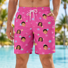 Model wearing Men's Astro Applause Custom Face Beach Shorts printed with kids' faces
