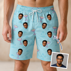Man wearing Men's Cork Kisses Custom Face Beach Shorts — custom faces printed all-over