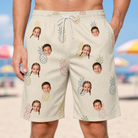 Model wearing Men's Fruitful Foursome Custom Face Beach Shorts printed with kids' faces