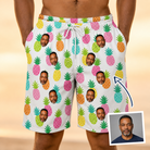 Man wearing Men's Poolside Pips Custom Face Beach Shorts — custom faces printed all-over