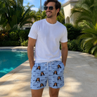 Real-life photo of someone wearing Men's Tri-Tone Tints Custom Face Beach Shorts — custom faces printed all-over