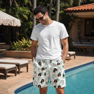 Real-life photo of someone wearing Men's Glove Affair Custom Face Beach Shorts — custom faces printed all-over