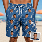 Man wearing Men's Treble Trouble Custom Face Beach Shorts — custom faces printed all-over