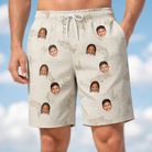 Model wearing Men's Creek Chic Custom Face Beach Shorts printed with kids' faces