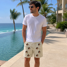 Real-life photo of someone wearing Men's Creek Chic Custom Face Beach Shorts — custom faces printed all-over