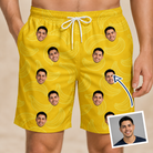 Man wearing Men's Cavendish Capers Custom Face Beach Shorts — custom faces printed all-over