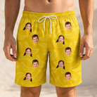 Model wearing Men's Cavendish Capers Custom Face Beach Shorts printed with kids' faces