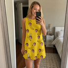 Real-life photo of someone wearing Women's Yellow Yodel Custom Face Tank Dress — custom faces printed all-over
