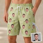 Man wearing Men's Pyrus Pizzazz Custom Face Beach Shorts — custom faces printed all-over