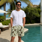 Real-life photo of someone wearing Men's Reed Revival Custom Face Beach Shorts — custom faces printed all-over