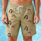 Model wearing Men's Cinder Calypso Custom Face Beach Shorts printed with kids' faces