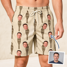 Man wearing Men's Rattan Radiance Custom Face Beach Shorts — custom faces printed all-over