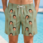 Model wearing Men's Flame Fête Custom Face Beach Shorts printed with kids' faces